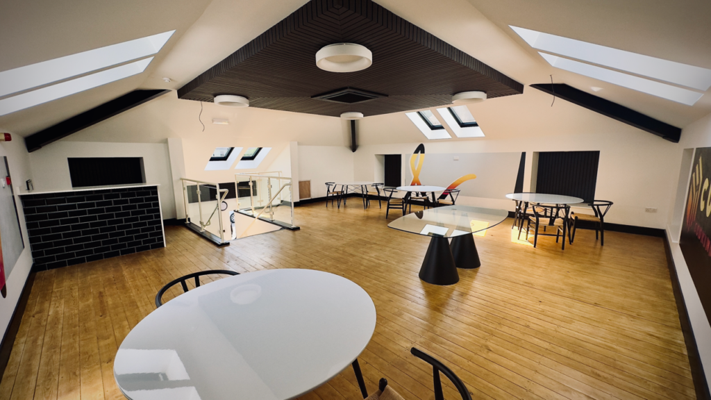 Image of interior of room with tables and chairs